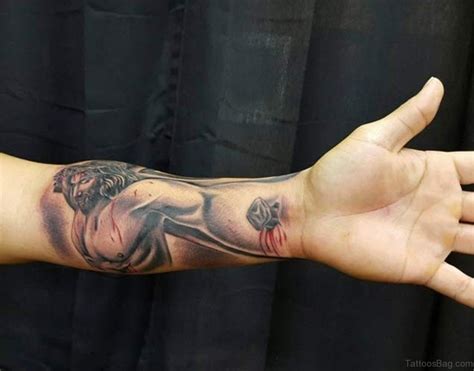 jesus christ forearm tattoo|jesus hand reaching out tattoo.